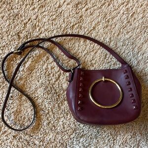 Elegant Burgundy Handbag with Gold Accents